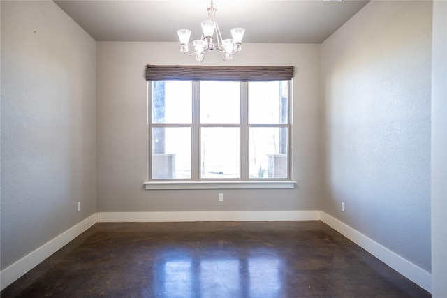 unfurnished room with a notable chandelier