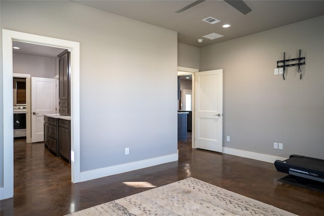 unfurnished bedroom with connected bathroom and ceiling fan