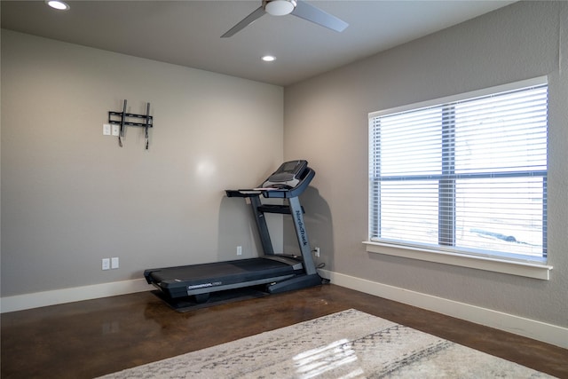 workout room featuring ceiling fan and a healthy amount of sunlight