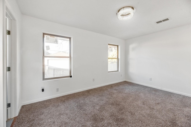 unfurnished room featuring carpet