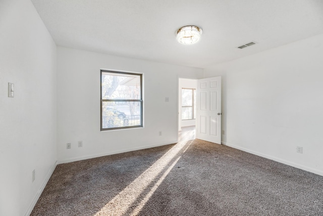 unfurnished room with carpet floors