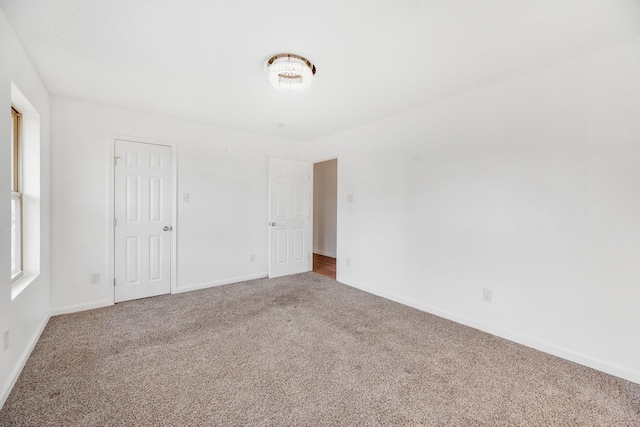 unfurnished room with carpet floors