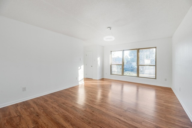 spare room featuring light hardwood / wood-style floors