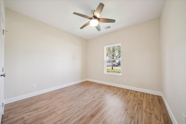 empty room with light wood-type flooring and ceiling fan