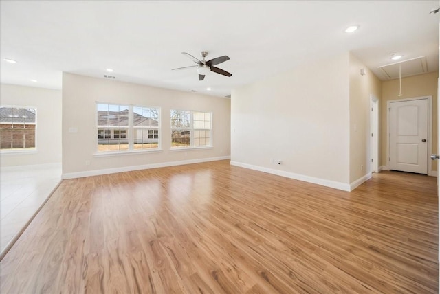 unfurnished living room featuring ceiling fan and light wood-type flooring