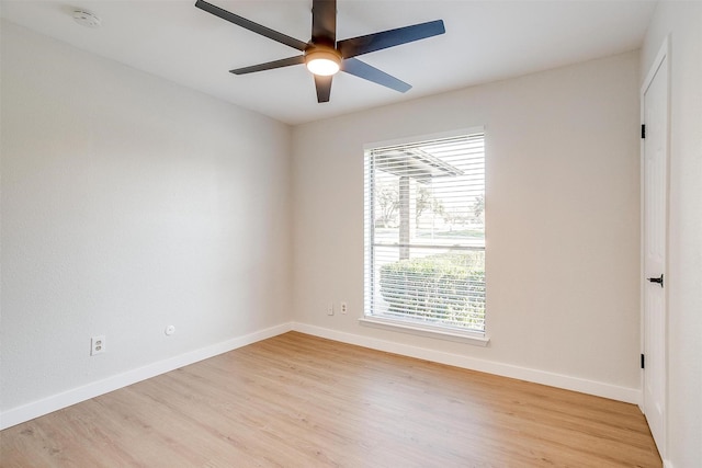 spare room with ceiling fan, a healthy amount of sunlight, and light hardwood / wood-style flooring