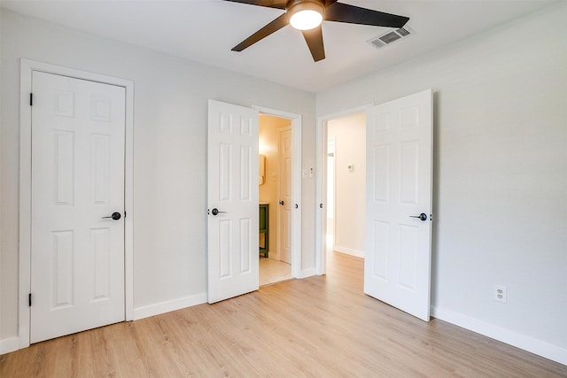 unfurnished bedroom featuring ceiling fan and light hardwood / wood-style flooring