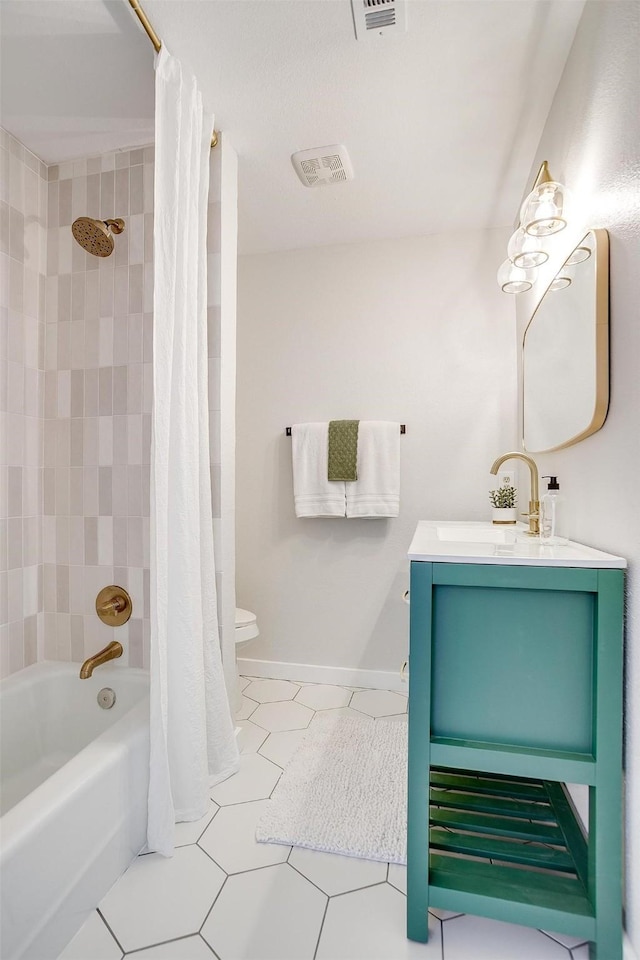 full bathroom featuring tile patterned flooring, vanity, shower / tub combo with curtain, and toilet