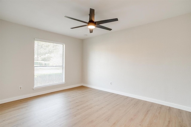 empty room with light wood-type flooring and ceiling fan