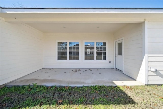 doorway to property featuring a patio