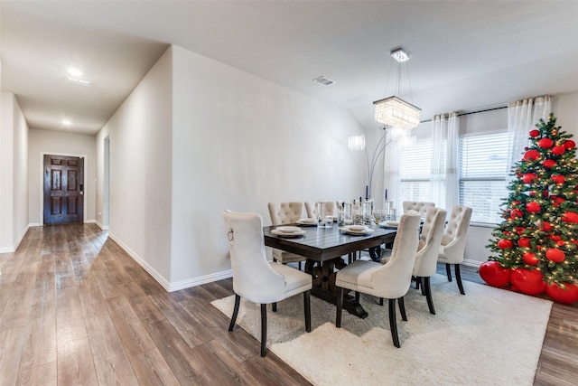 dining room with hardwood / wood-style flooring