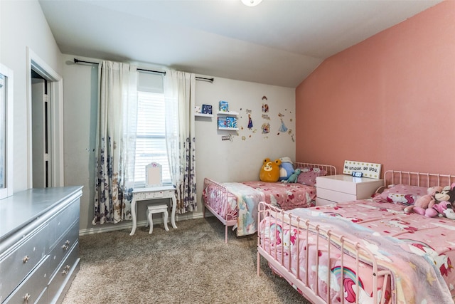 carpeted bedroom with vaulted ceiling