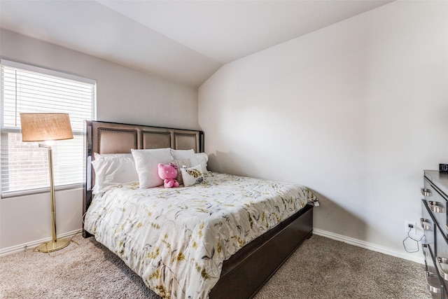 bedroom featuring vaulted ceiling and dark colored carpet