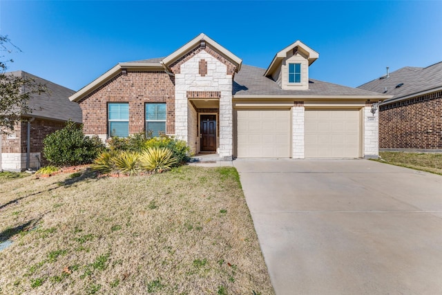 view of front of property featuring a garage and a front yard