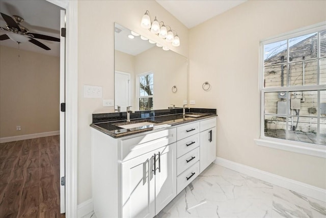 bathroom featuring ceiling fan, plenty of natural light, and vanity