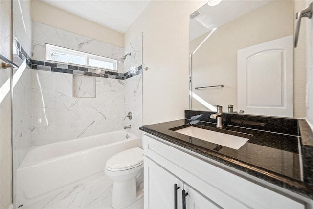 full bathroom featuring toilet, vanity, and tiled shower / bath