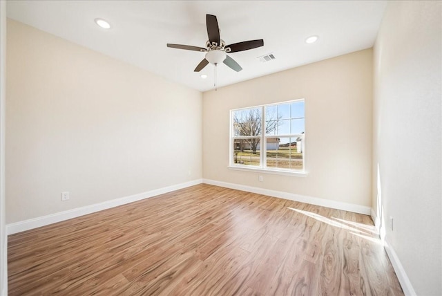 unfurnished room featuring ceiling fan and light wood-type flooring