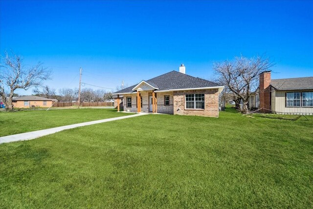 ranch-style house with a front lawn