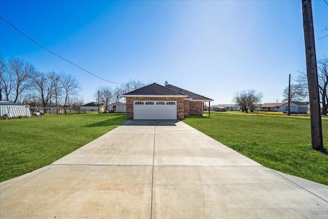 single story home featuring a front yard and a garage