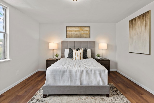 bedroom featuring dark hardwood / wood-style floors