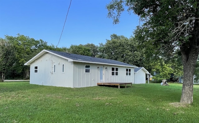 back of house with a yard