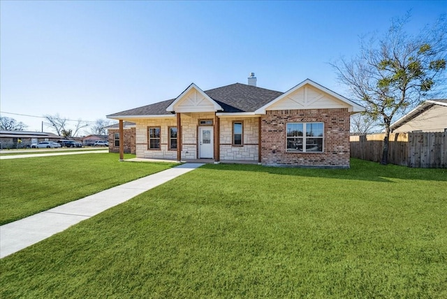 ranch-style home featuring a front yard