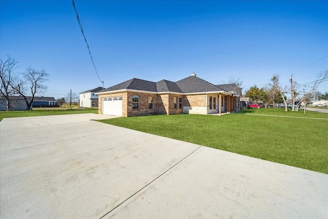 ranch-style house with a garage and a front yard