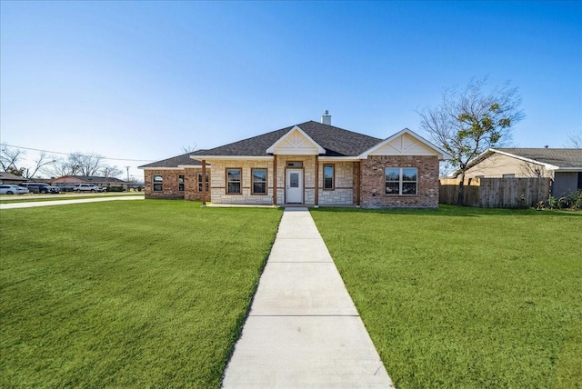 ranch-style house with covered porch and a front lawn