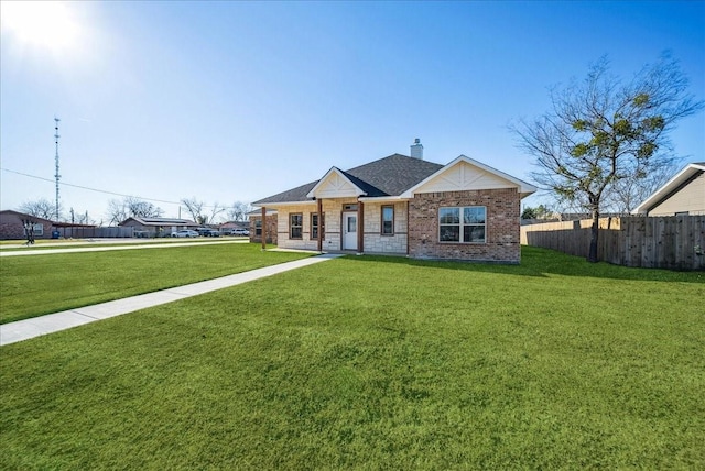 single story home featuring a front yard