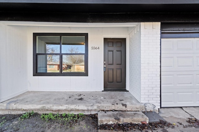 doorway to property featuring a garage