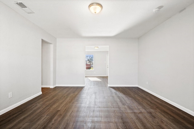 empty room featuring dark hardwood / wood-style floors