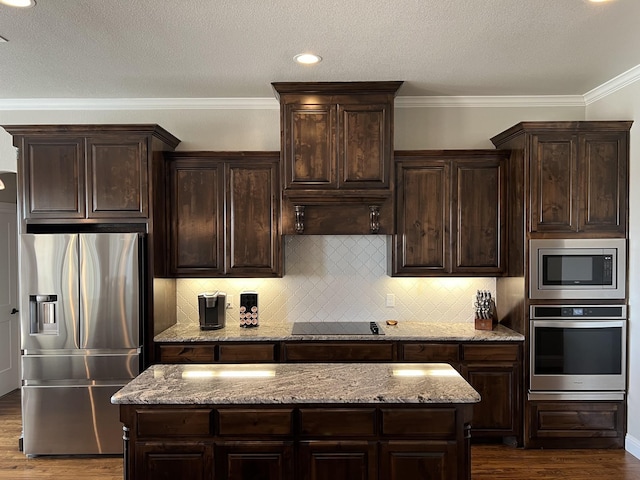 kitchen with dark brown cabinets and stainless steel appliances