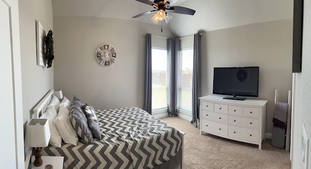 carpeted bedroom featuring vaulted ceiling and ceiling fan