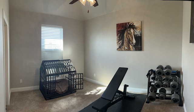 exercise room featuring carpet flooring, vaulted ceiling, and ceiling fan