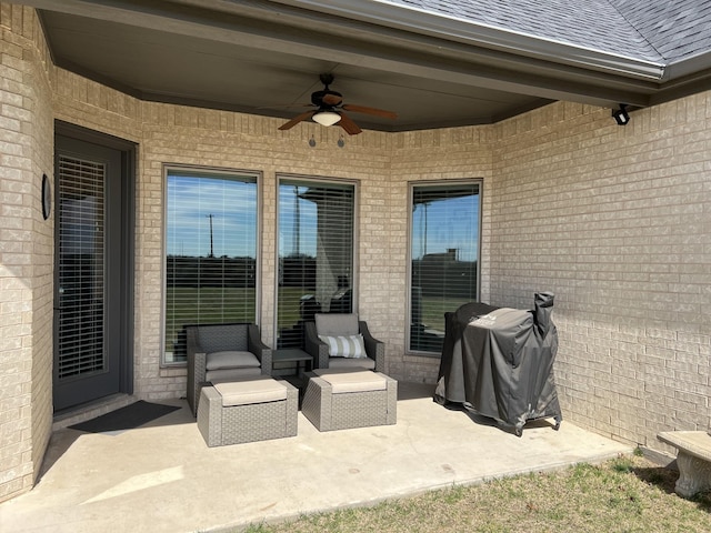 view of patio with ceiling fan and area for grilling