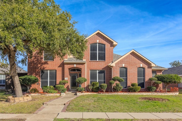 front facade featuring a front yard