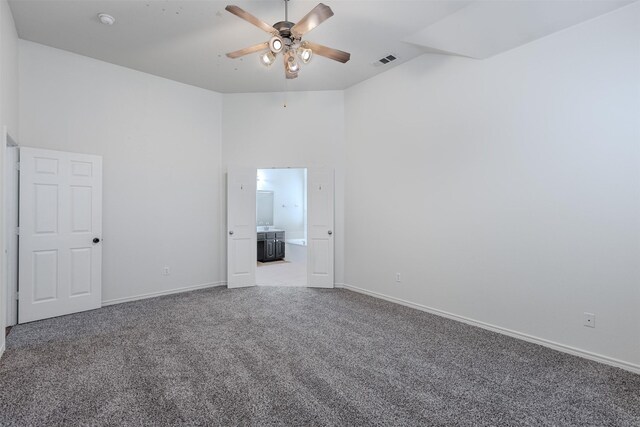 unfurnished room featuring carpet and ceiling fan