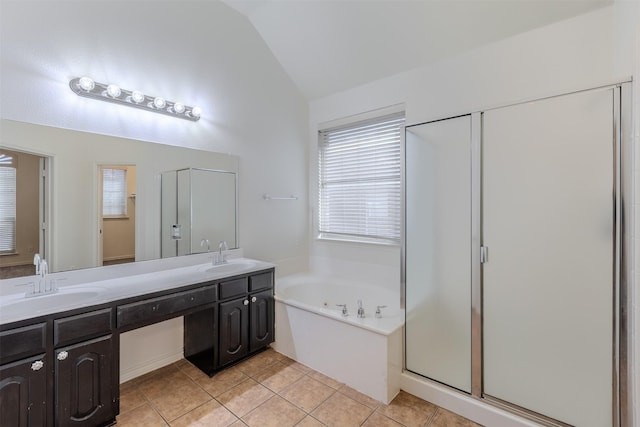 bathroom featuring tile patterned floors, vanity, vaulted ceiling, and independent shower and bath