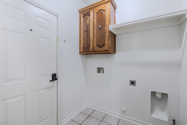 laundry room with cabinets, hookup for a gas dryer, hookup for a washing machine, light tile patterned floors, and hookup for an electric dryer