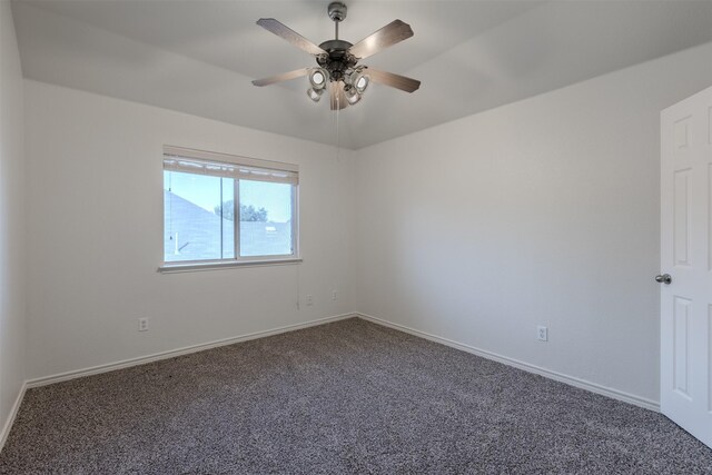 carpeted empty room with ceiling fan