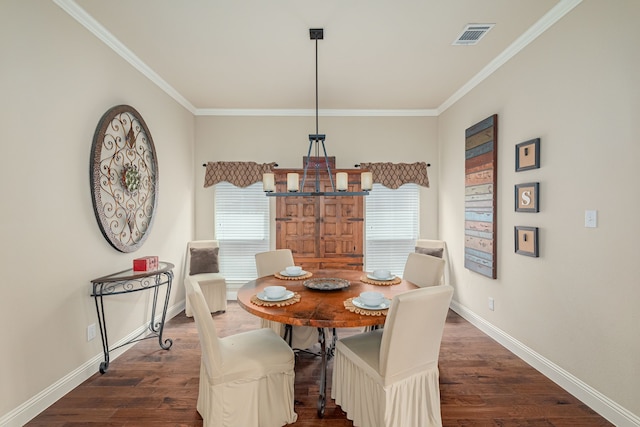 dining room featuring dark hardwood / wood-style floors and ornamental molding