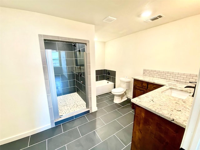 full bathroom featuring tile patterned flooring, vanity, toilet, and plus walk in shower