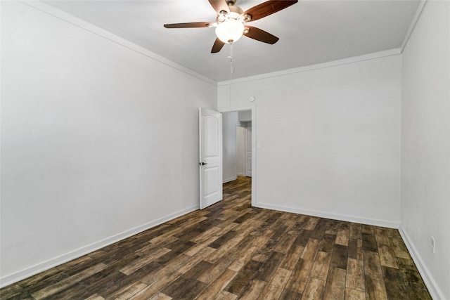 spare room with ceiling fan, dark hardwood / wood-style flooring, and crown molding