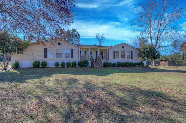 ranch-style house with a porch and a front lawn