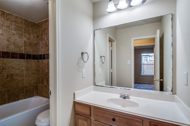 bathroom with shower / tub combination, vanity, and toilet