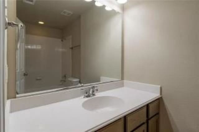 bathroom with vanity and toilet