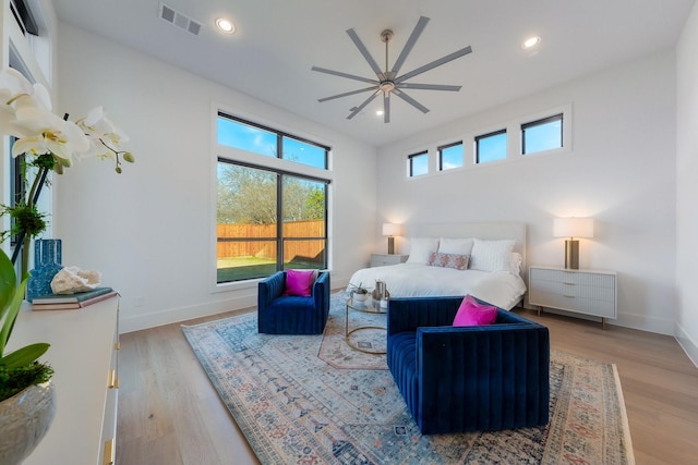 bedroom featuring recessed lighting, visible vents, baseboards, and wood finished floors