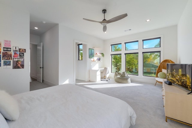 bedroom with a ceiling fan, recessed lighting, light colored carpet, and visible vents