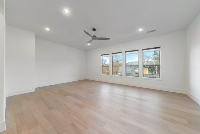 unfurnished room featuring light wood finished floors, visible vents, baseboards, recessed lighting, and a ceiling fan