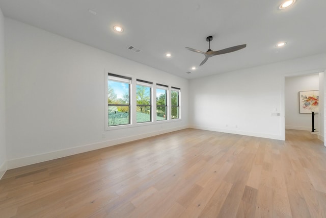 empty room with visible vents, recessed lighting, baseboards, and light wood-style floors